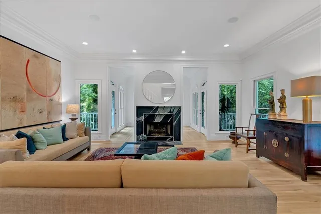 a kitchen with stainless steel appliances granite countertop a stove and a wooden floors