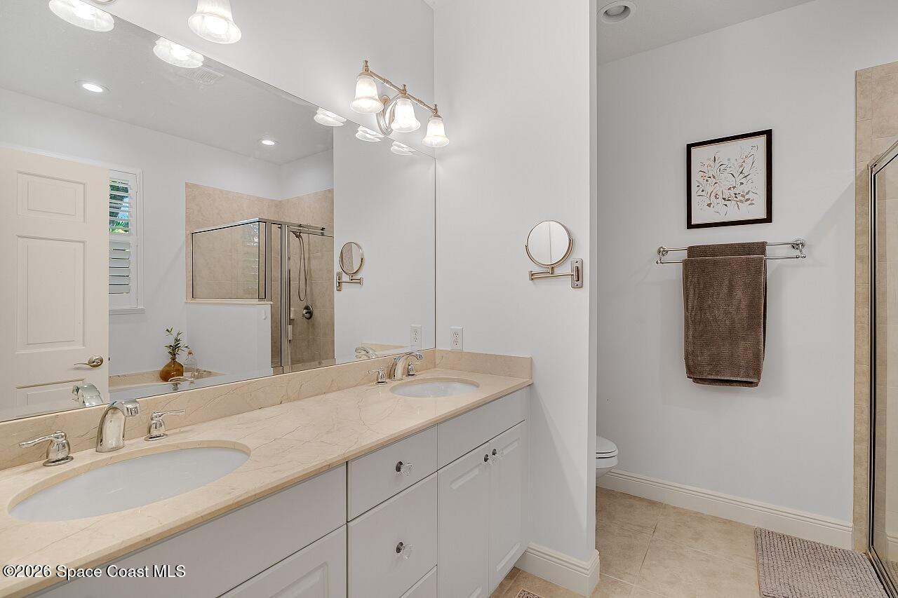 1629 Baseline Lane Vero Beach, FL 32967 - Photo 13 of 29 a bathroom with a sink double vanity granite and a mirror