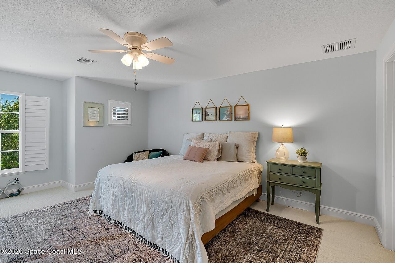 1629 Baseline Lane Vero Beach, FL 32967 - Photo 17 of 29 a bedroom with a bed and a window