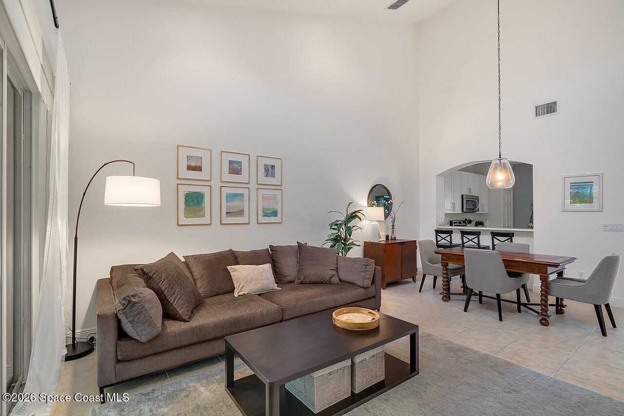 1629 Baseline Lane Vero Beach, FL 32967 - Photo 3 of 29 a living room with furniture a rug and a window