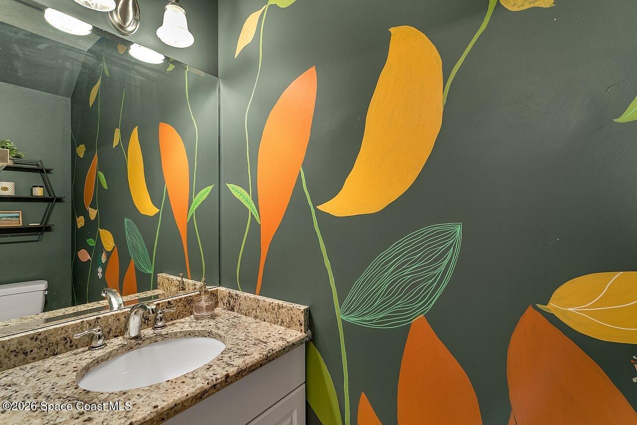 1629 Baseline Lane Vero Beach, FL 32967 - Photo 9 of 29 a bathroom with a sink and mirror