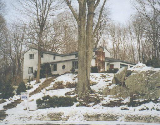 72 Hunter Lane Ridgefield, CT 06877 - Photo 1 of 1 a view of a house with snow on the background