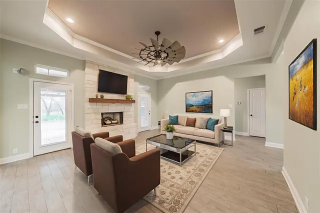 a living room with furniture and a fireplace