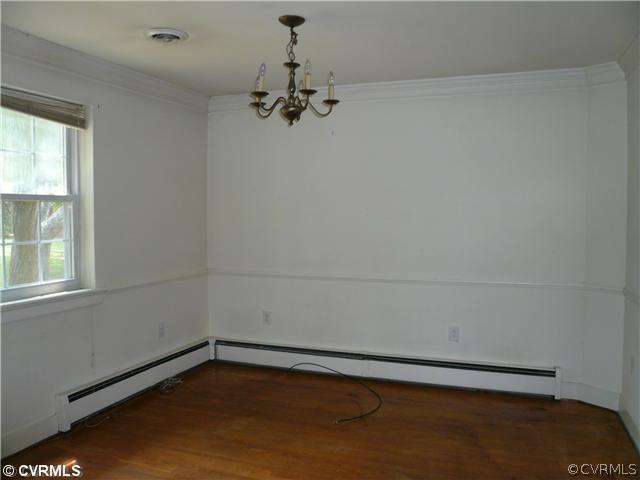 307 Wilkinson Road Richmond, VA 23227 - Photo 3 of 11 a view of a room with rack on the wall and a window