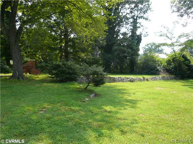 307 Wilkinson Road Richmond, VA 23227 - Photo 10 of 11 a view of green field with trees in the background