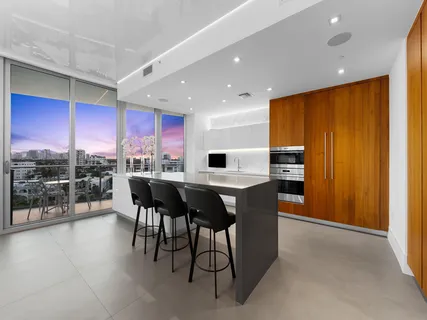 a kitchen with a table and chairs