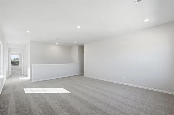 an empty room with wooden floor