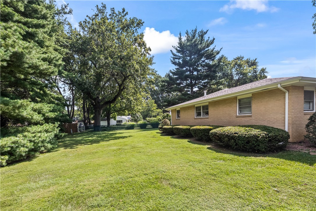 28 Mahnke Road Decatur, IL 62526 - Photo 25 of 27 a view of a backyard with plants and a patio