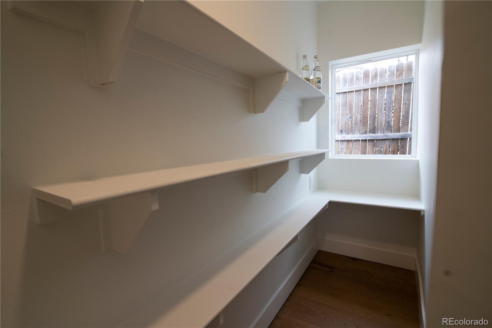 2831 Perry Street Denver, CO 80212 - Photo 11 of 29 a view of an empty room with a window