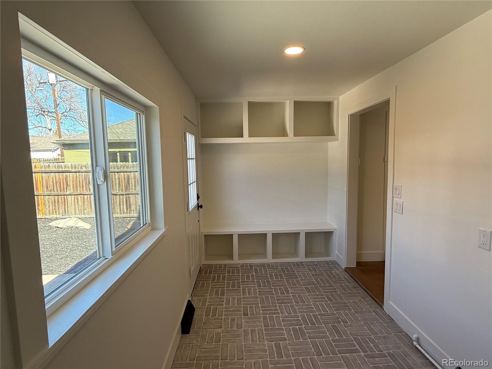 2831 Perry Street Denver, CO 80212 - Photo 12 of 29 a view of a big room with windows