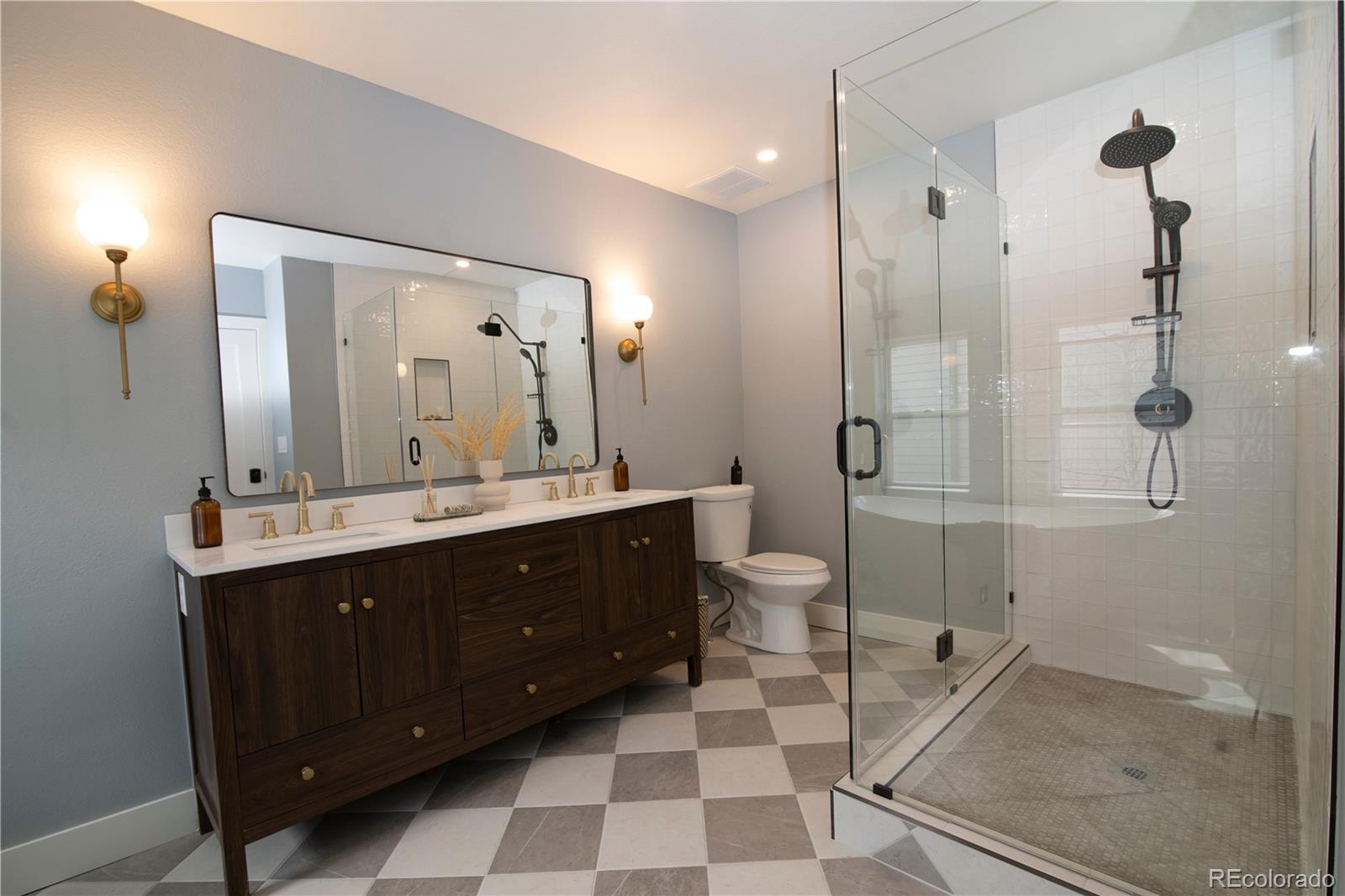 2831 Perry Street Denver, CO 80212 - Photo 20 of 29 a spacious bathroom with a double vanity sink toilet mirror and shower