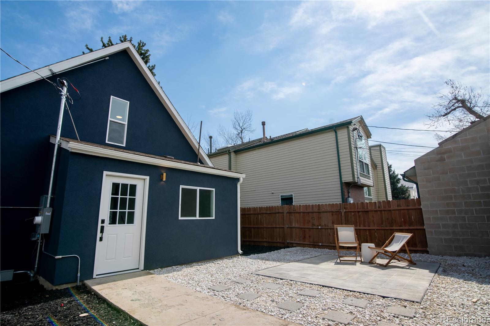 2831 Perry Street Denver, CO 80212 - Photo 25 of 29 a backyard of a house with table and chairs