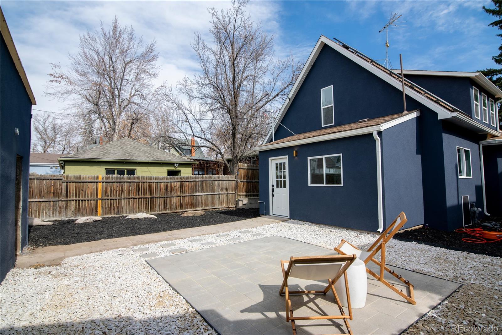 2831 Perry Street Denver, CO 80212 - Photo 26 of 29 a backyard of a house with table and chairs