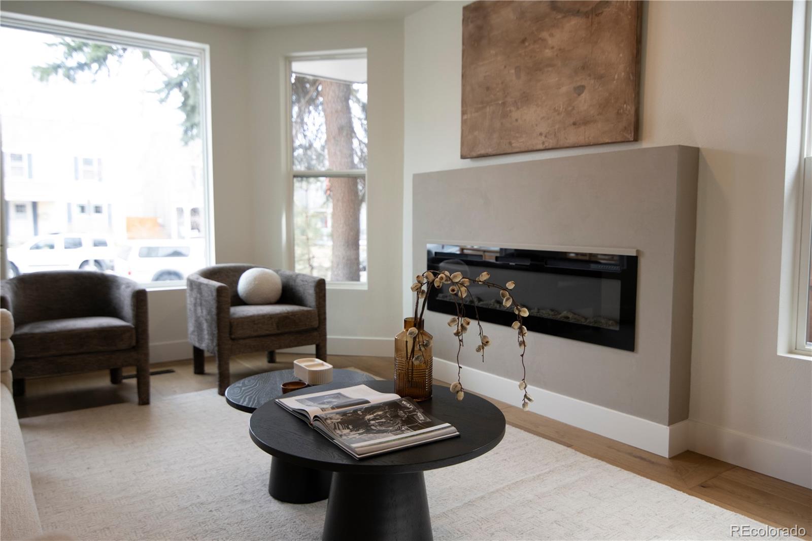 2831 Perry Street Denver, CO 80212 - Photo 4 of 29 a living room with furniture a fireplace and a large window