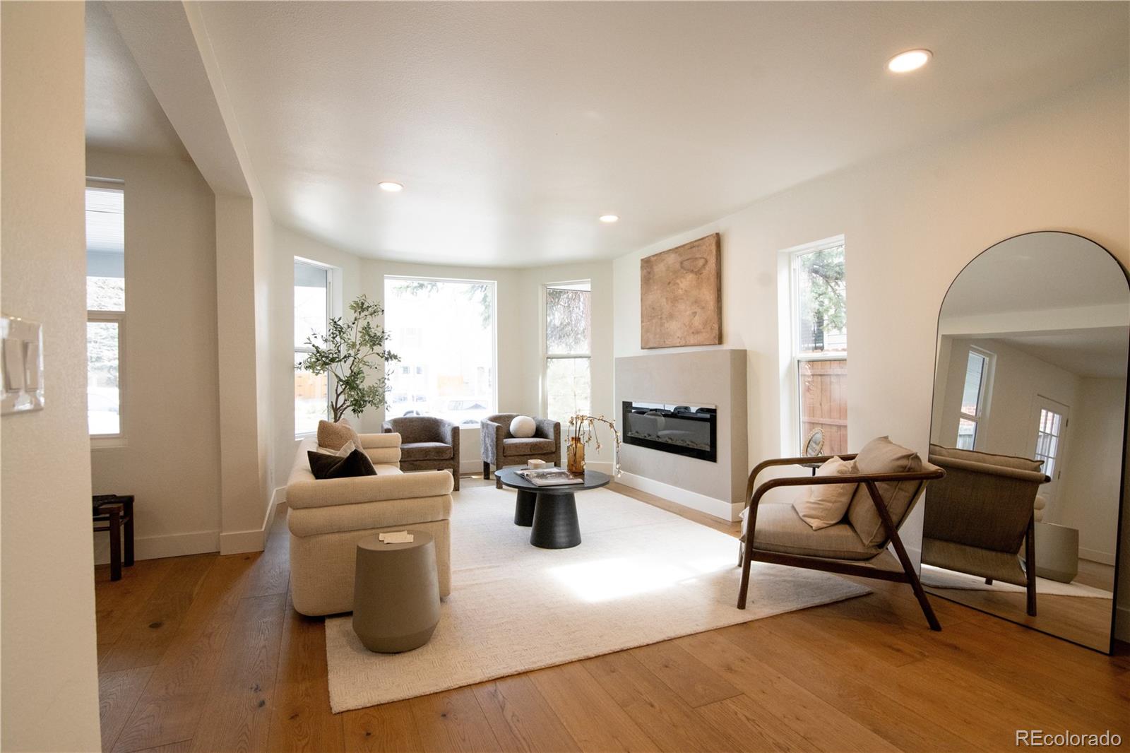 2831 Perry Street Denver, CO 80212 - Photo 5 of 29 a living room with furniture and a fireplace