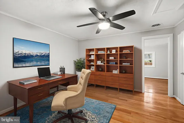 a view of a workspace with furniture