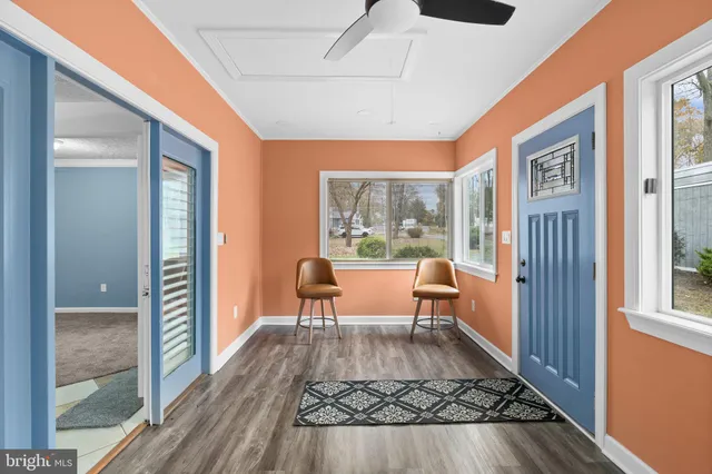 a living room with furniture and a rug