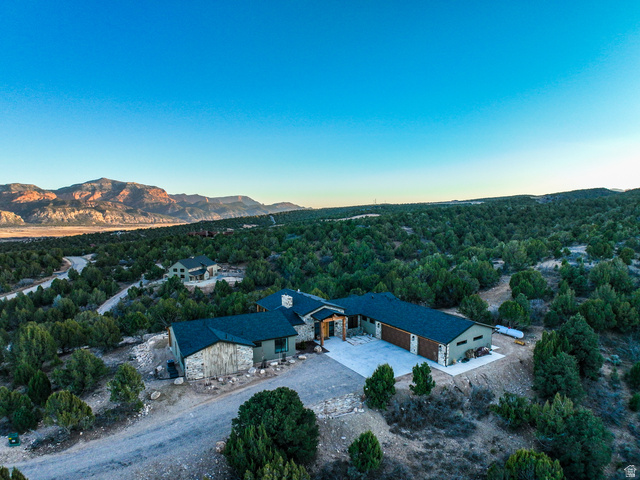 6688 Bareback Road Cedar City, UT 84720 - Photo 34 of 58 Aerial view at dusk of a mountain view and a forest view