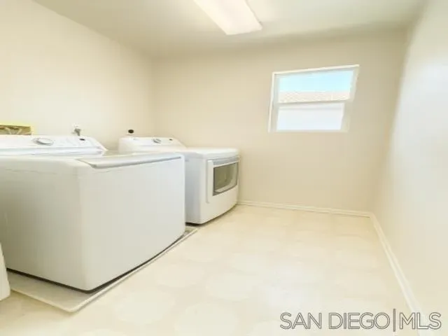 a view of chair and tables back yard of the house