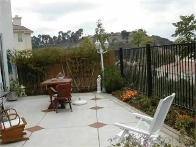 11855 Westview Parkway San Diego, CA 92126 - Photo 8 of 9 a view of chair and tables back yard of the house