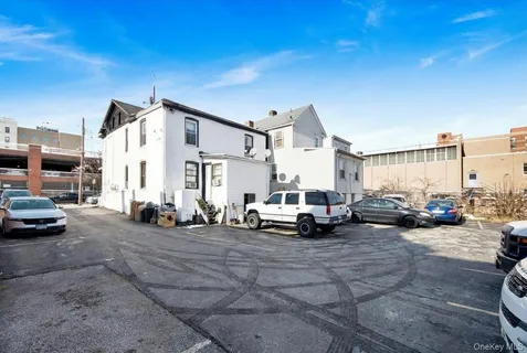 a view of a cars park in front of house