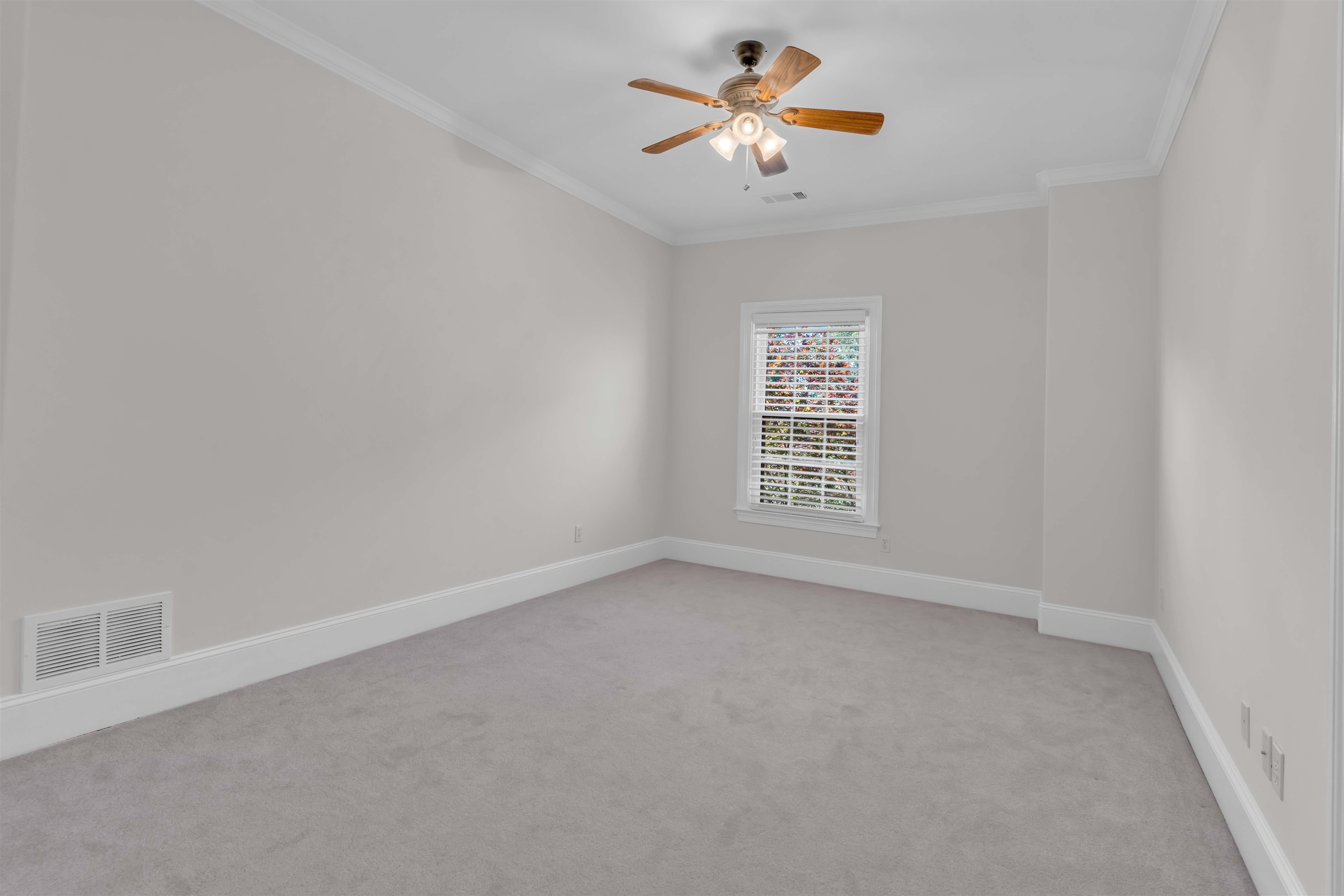 680 Highway 193 Collierville, TN 38017 - Photo 31 of 38 Neutral-toned room with light gray carpet, white baseboards, and crown molding