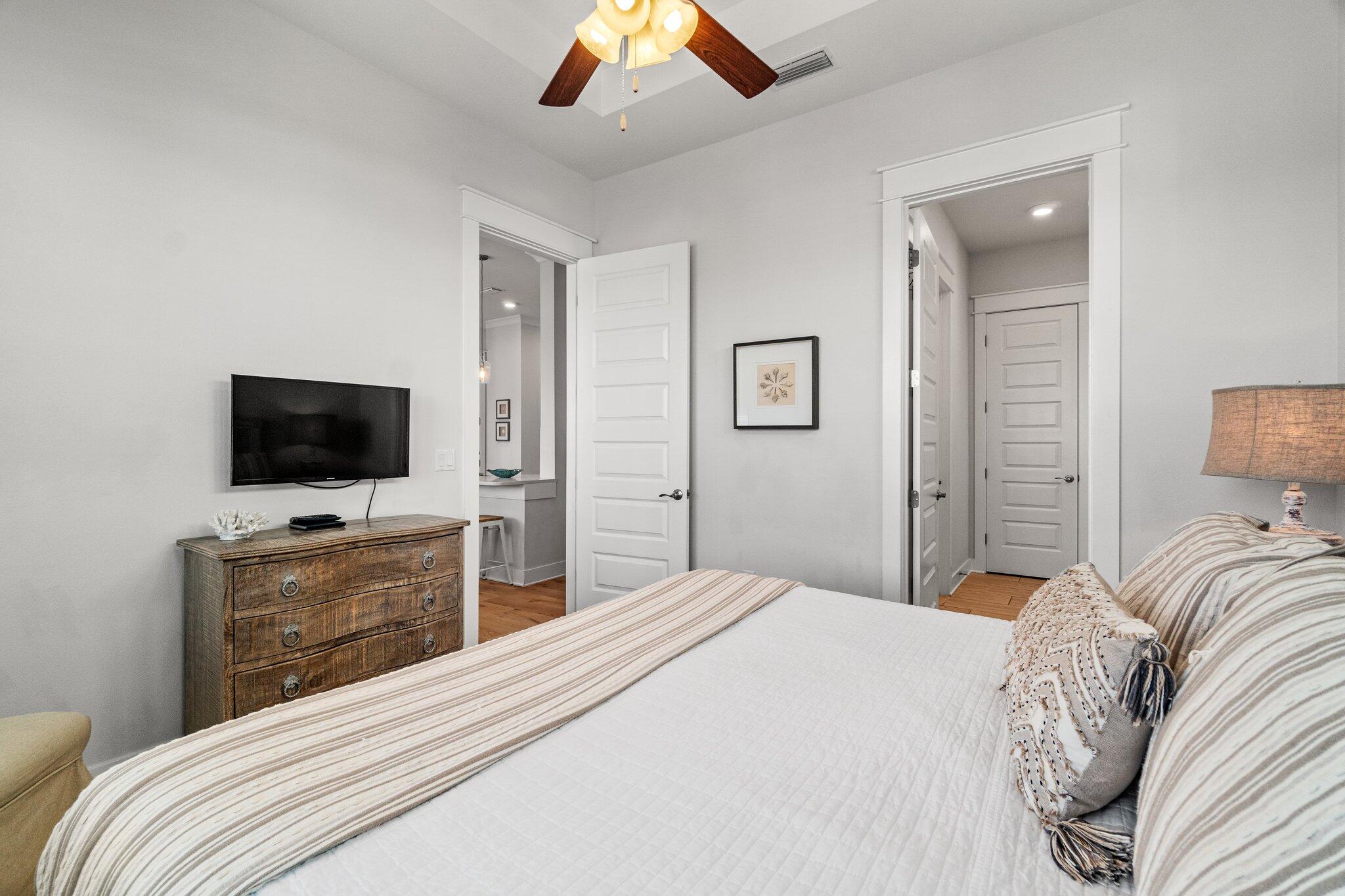 89 Pine Lands Loop Inlet Beach, Unit C Inlet Beach, FL 32461 - Photo 11 of 65 a bedroom with a bed and a flat screen tv