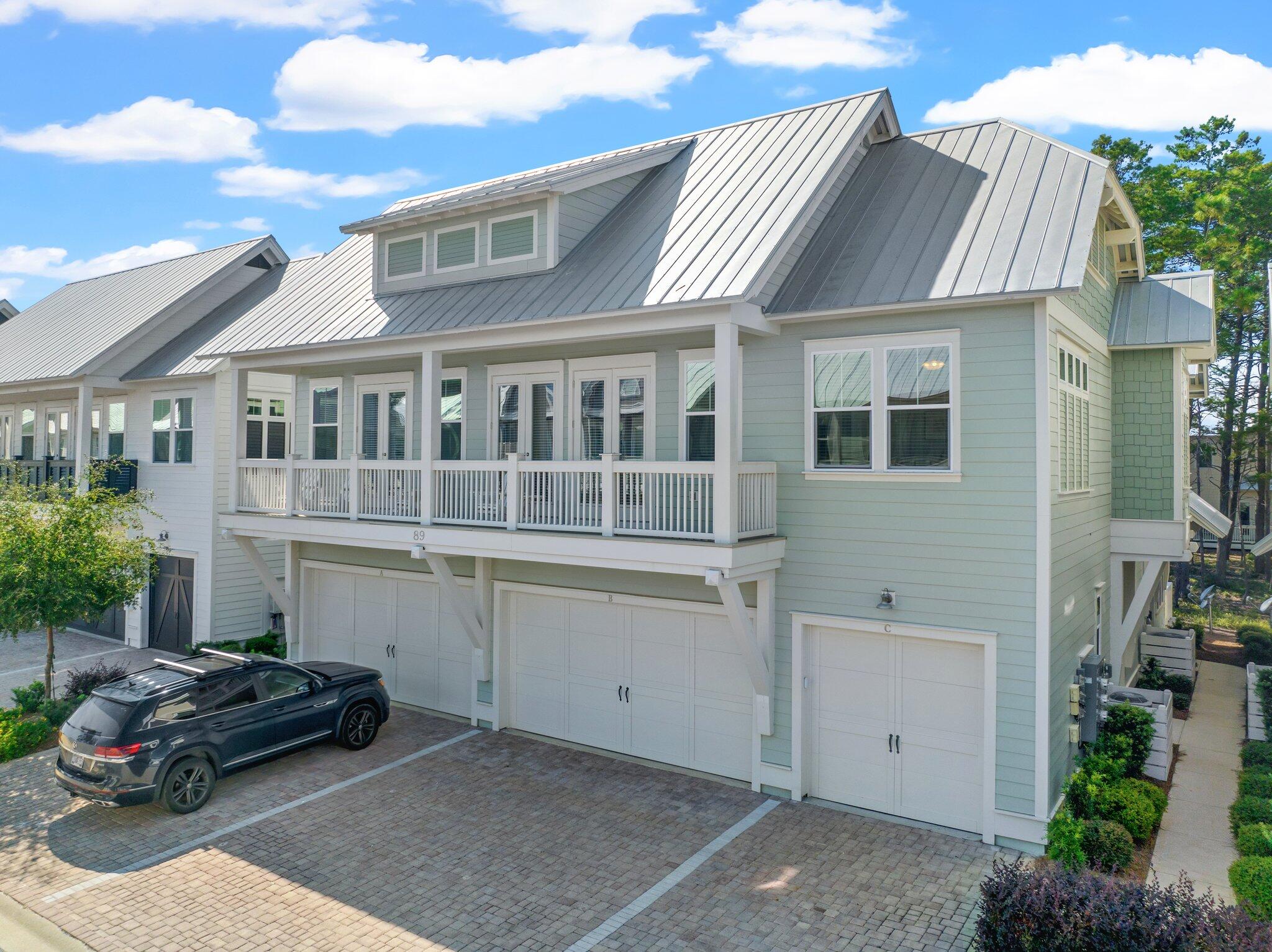 89 Pine Lands Loop Inlet Beach, Unit C Inlet Beach, FL 32461 - Photo 19 of 65 a car parked in front of a house