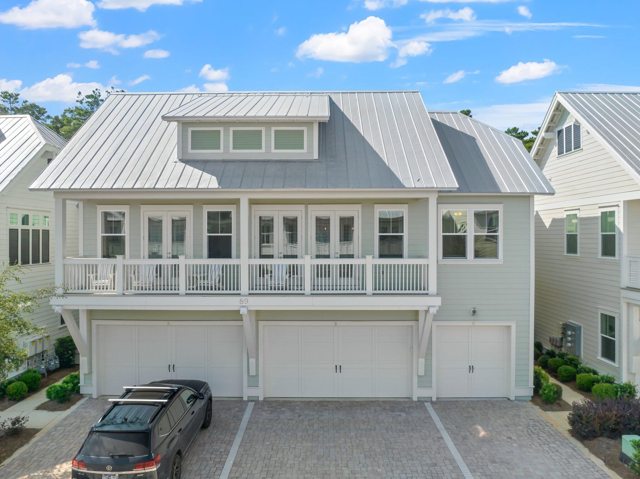 89 Pine Lands Loop Inlet Beach, Unit C Inlet Beach, FL 32461 - Photo 20 of 65 a view of a house with a backyard