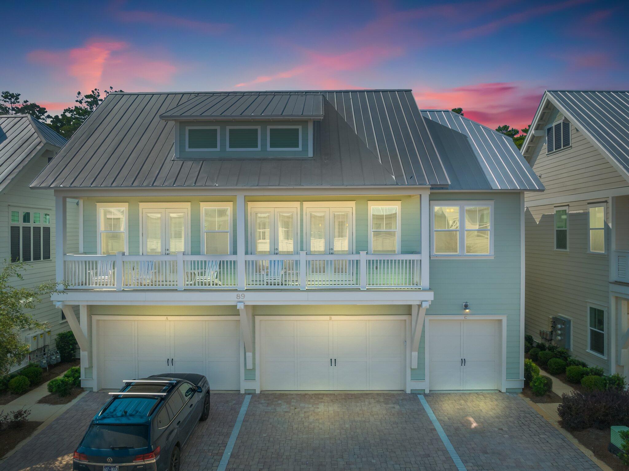 89 Pine Lands Loop Inlet Beach, Unit C Inlet Beach, FL 32461 - Photo 21 of 65 a view of a house with a garage