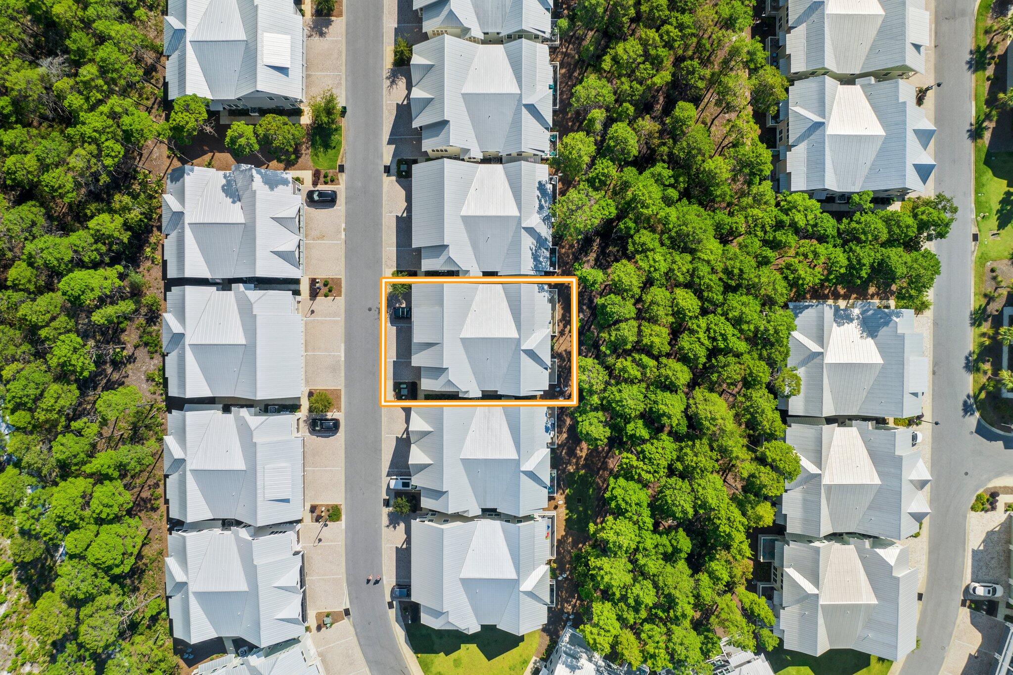 89 Pine Lands Loop Inlet Beach, Unit C Inlet Beach, FL 32461 - Photo 31 of 65 an aerial view of residential houses with outdoor space and trees