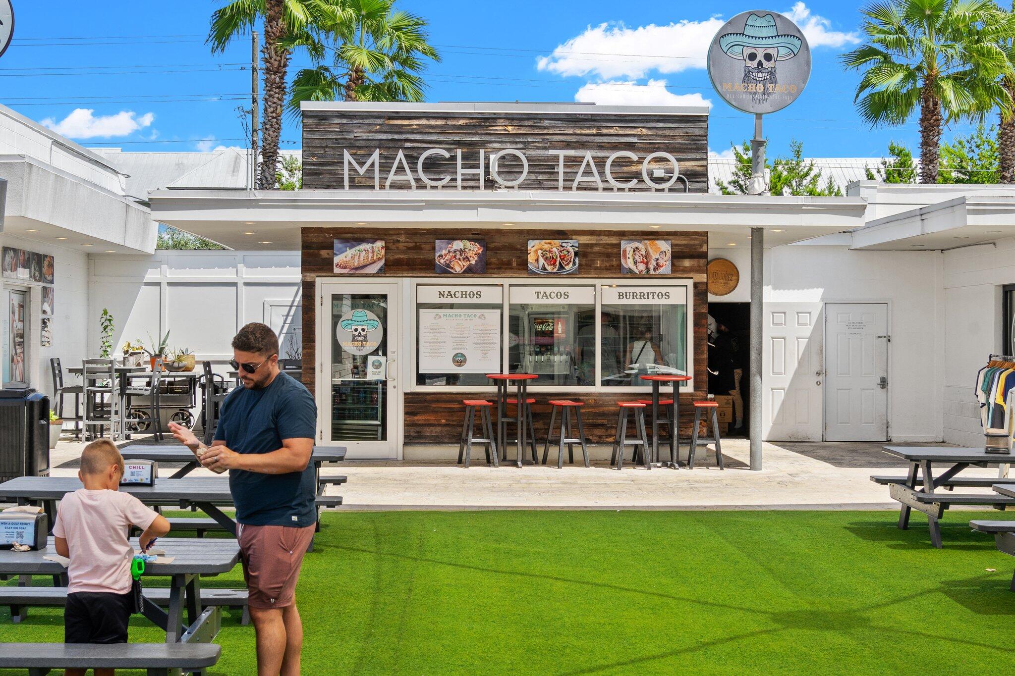 89 Pine Lands Loop Inlet Beach, Unit C Inlet Beach, FL 32461 - Photo 55 of 65 a view of a cafe with a table and chairs