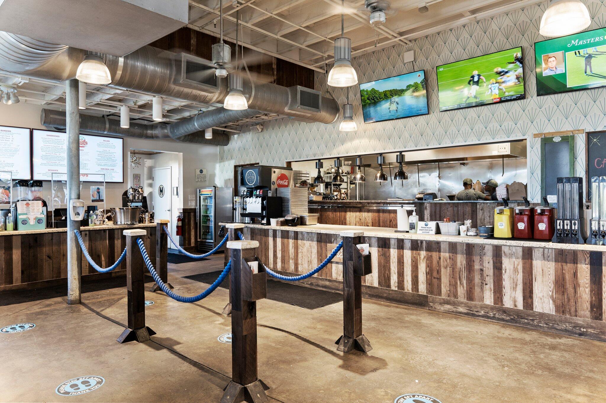 89 Pine Lands Loop Inlet Beach, Unit C Inlet Beach, FL 32461 - Photo 61 of 65 a room with lots of wooden furniture and chairs