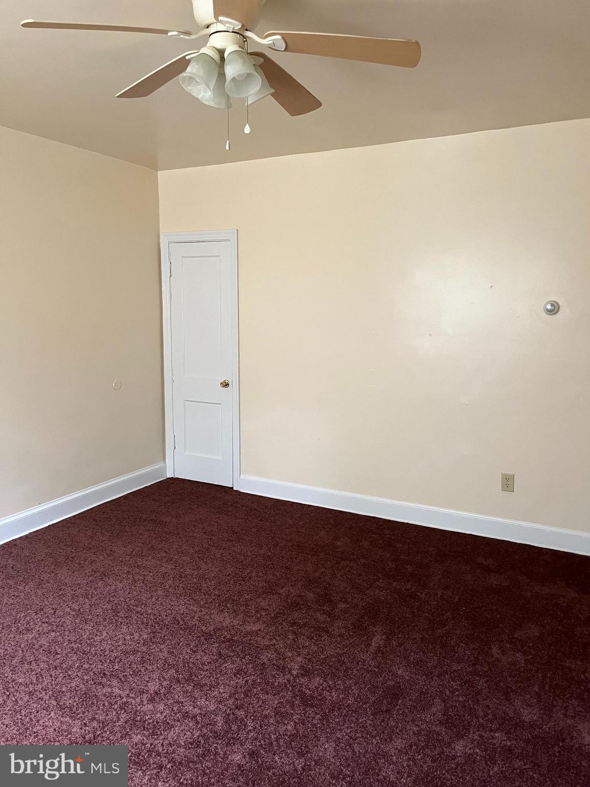 1641 V Street Southeast, Unit 2 Washington, DC 20020 - Photo 13 of 16 an empty room with a ceiling fan and wooden floor
