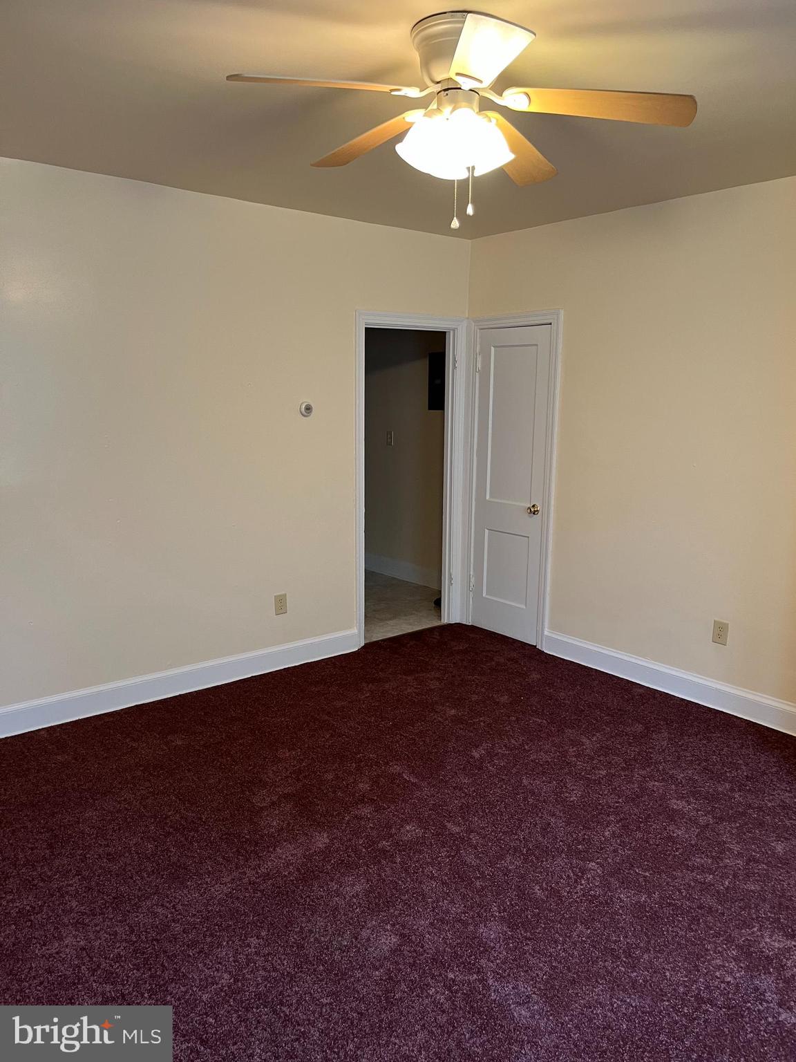 1641 V Street Southeast, Unit 2 Washington, DC 20020 - Photo 5 of 16 an empty room with a fan and a ceiling fan
