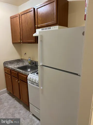 a bathroom with a toilet and a sink