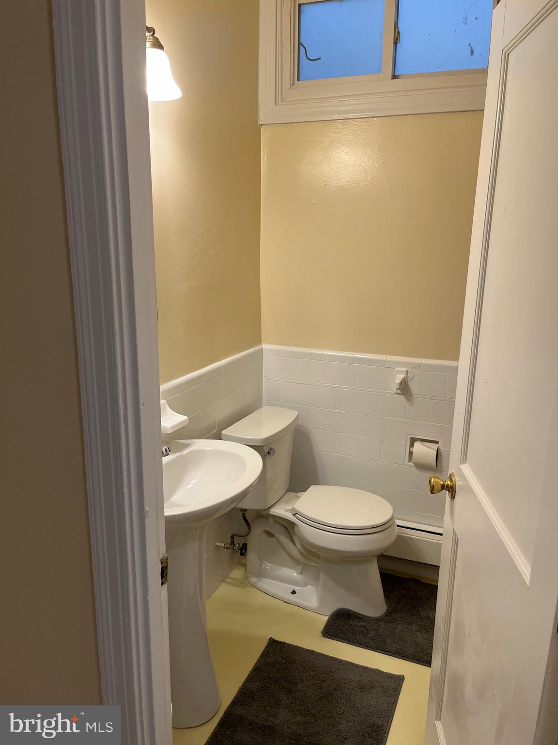 1641 V Street Southeast, Unit 2 Washington, DC 20020 - Photo 7 of 16 a bathroom with a toilet and a sink