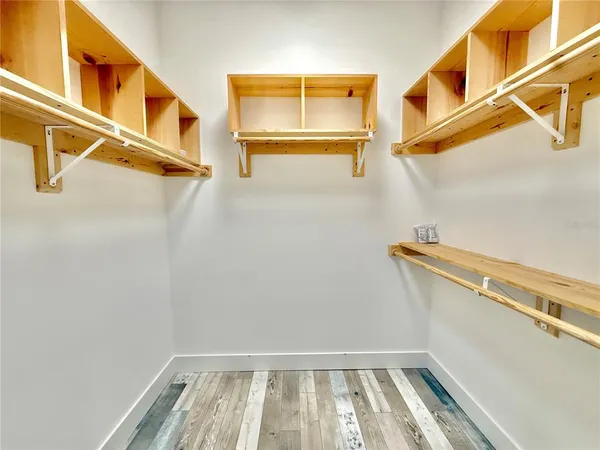 a bathroom with a granite countertop sink toilet and shower view