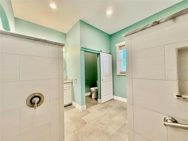 a house view with swimming pool in front of it