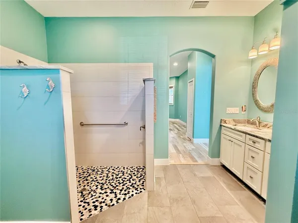 a front view of a house with garden and porch