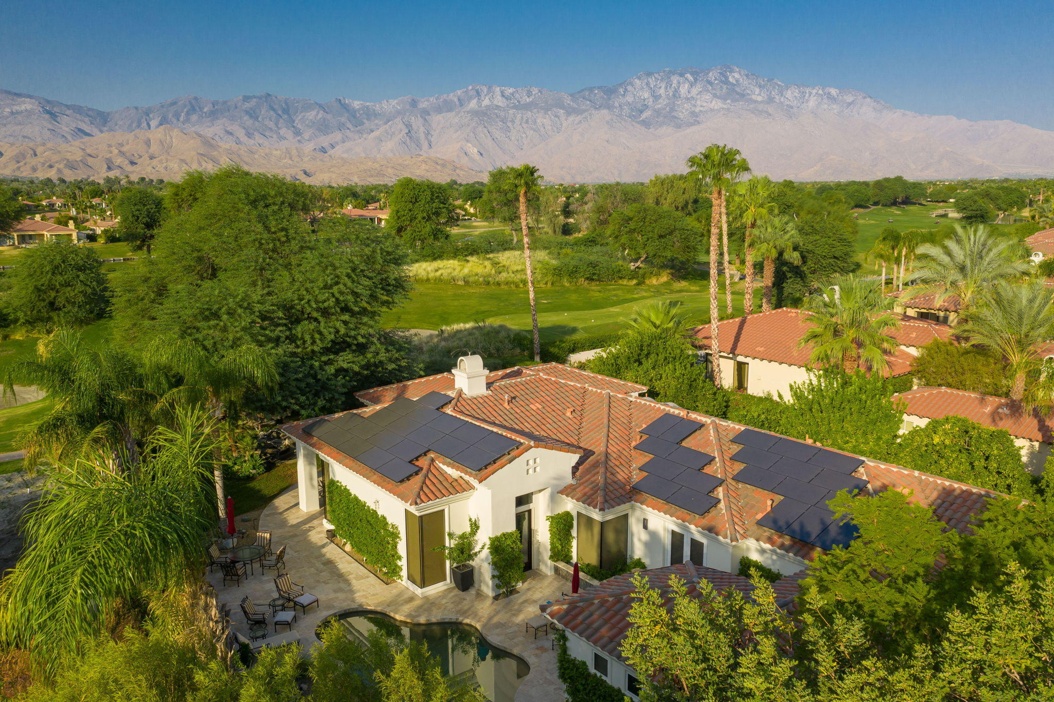 202 Loch Lomond Road Rancho Mirage, CA 92270 - Photo 2 of 47 an aerial view of a house with a yard