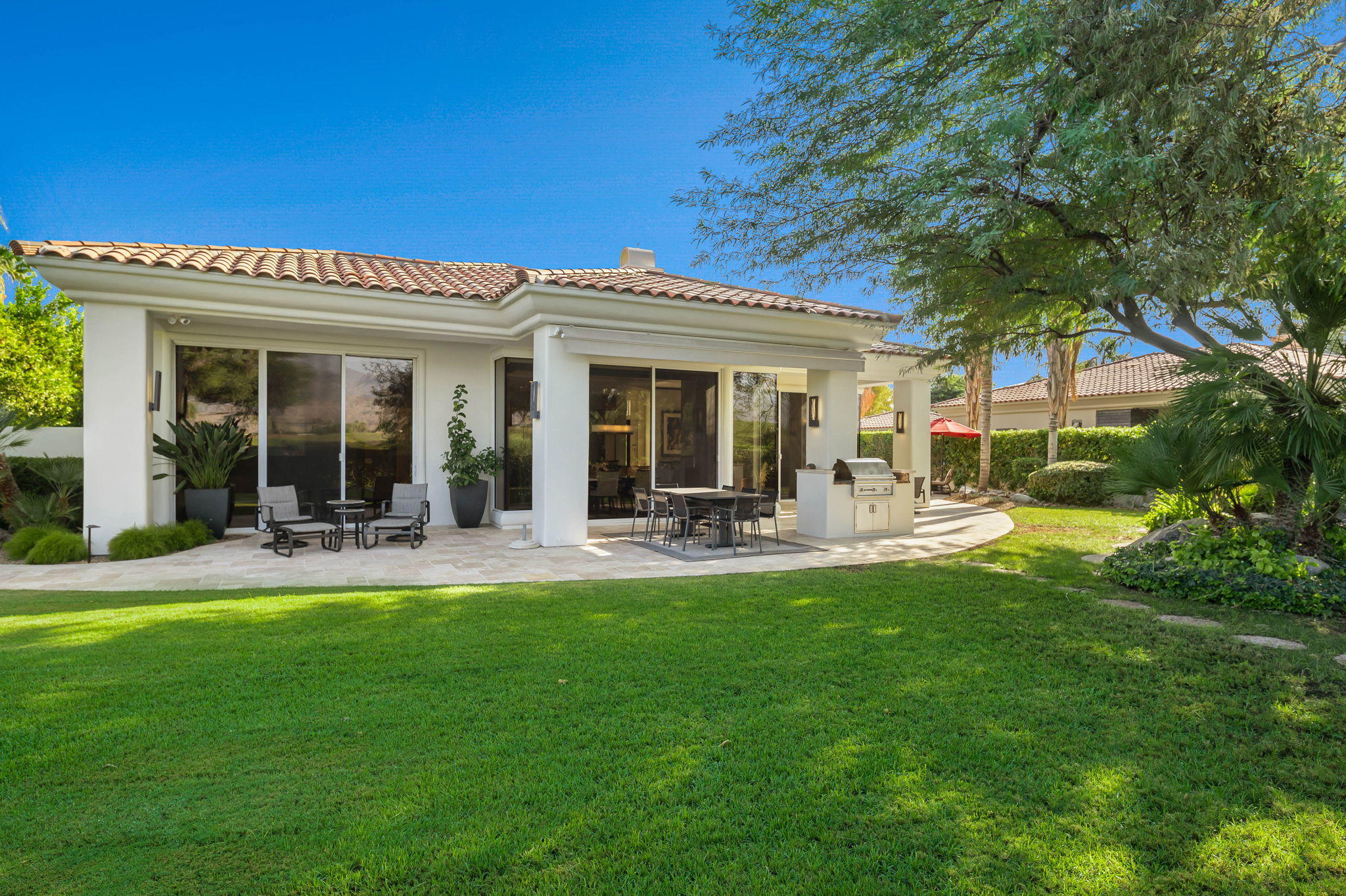 202 Loch Lomond Road Rancho Mirage, CA 92270 - Photo 3 of 47 a view of a house with backyard porch and patio