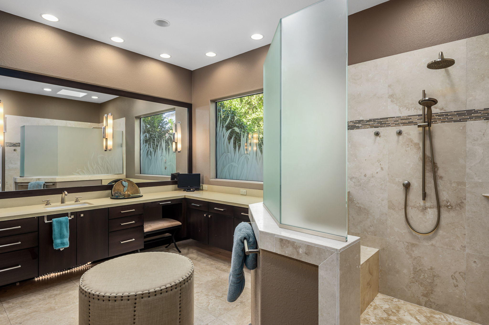 202 Loch Lomond Road Rancho Mirage, CA 92270 - Photo 21 of 47 a bathroom with a granite countertop sink a toilet a mirror and shower