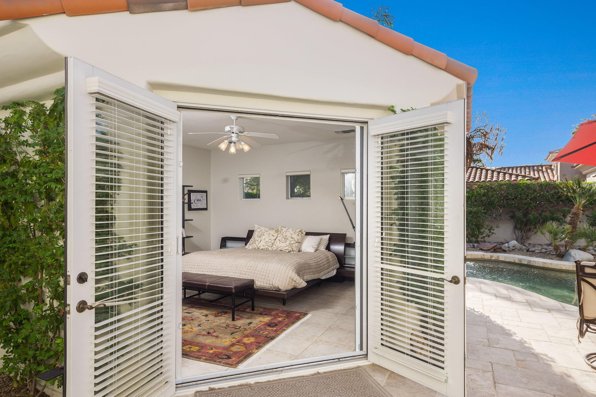 202 Loch Lomond Road Rancho Mirage, CA 92270 - Photo 26 of 47 a bedroom with a bed and a window