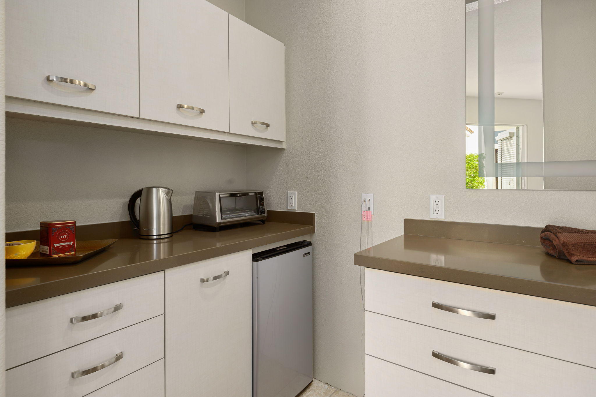 202 Loch Lomond Road Rancho Mirage, CA 92270 - Photo 28 of 47 a kitchen with granite countertop white cabinets and a sink