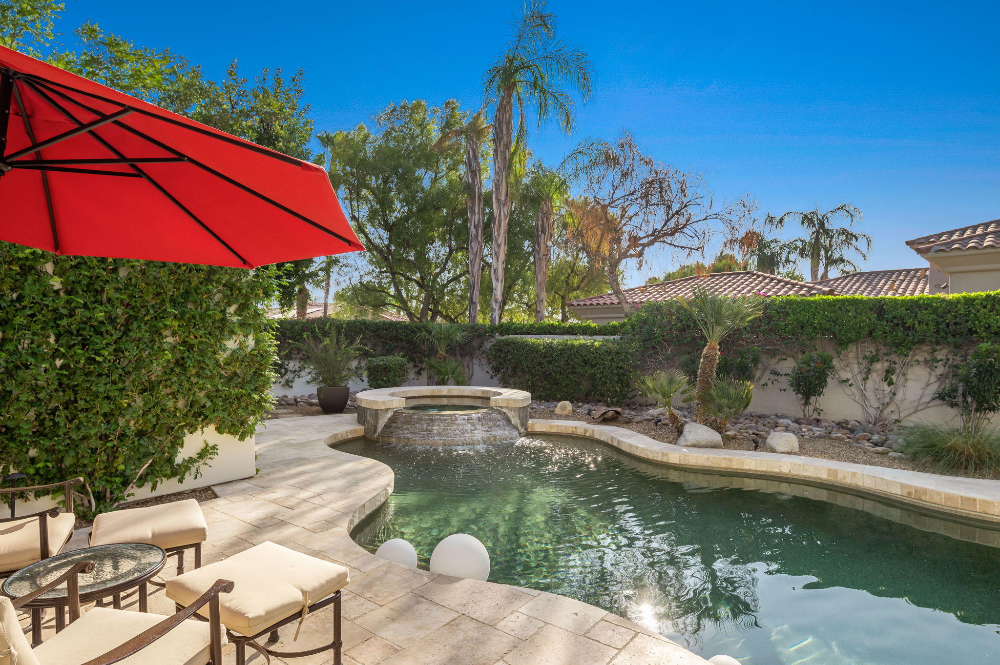 202 Loch Lomond Road Rancho Mirage, CA 92270 - Photo 4 of 47 a view of swimming pool with outdoor seating and yard