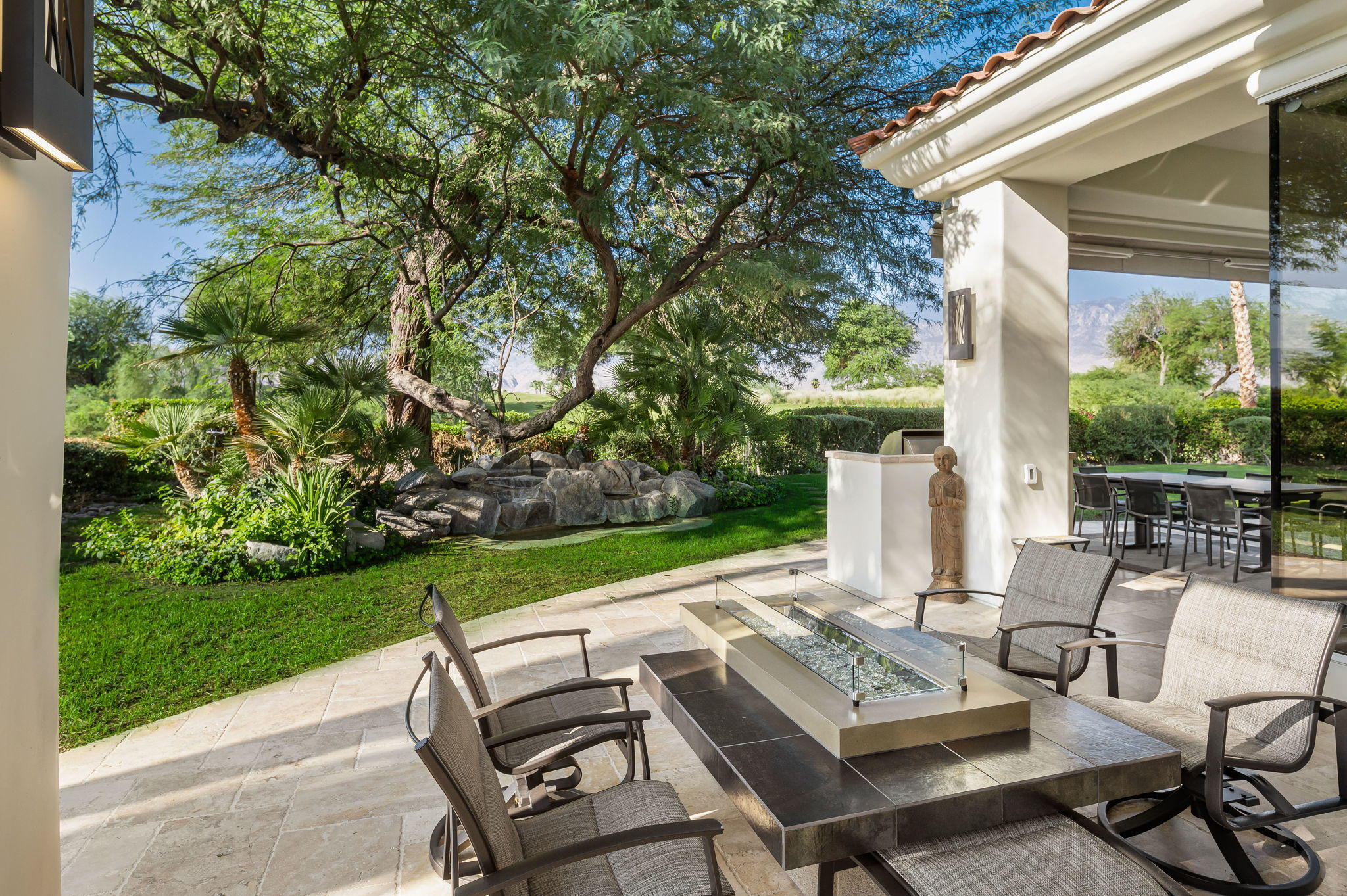202 Loch Lomond Road Rancho Mirage, CA 92270 - Photo 33 of 47 a view of a patio with couple of chairs