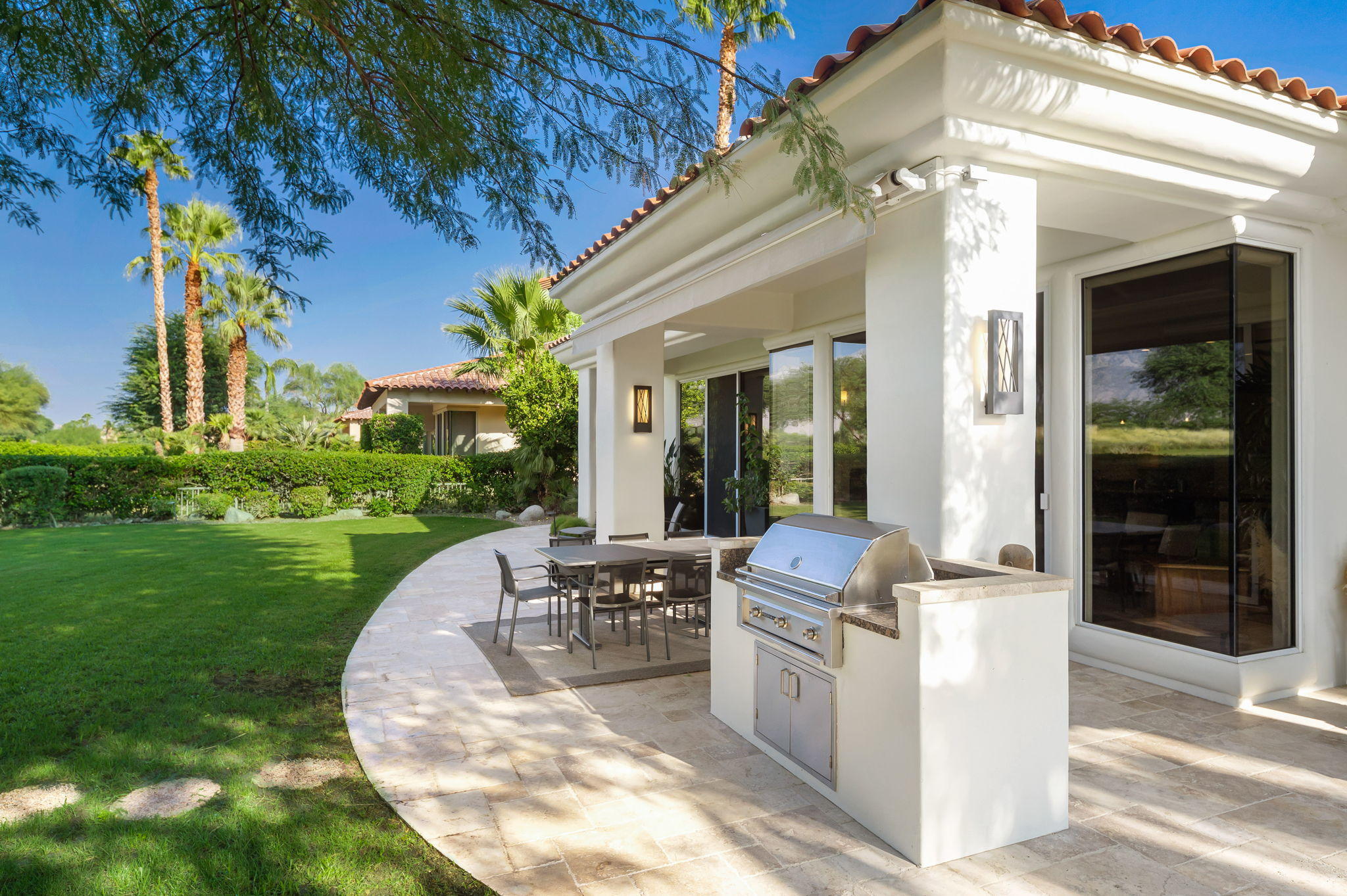 202 Loch Lomond Road Rancho Mirage, CA 92270 - Photo 35 of 47 a view of a house with backyard porch and furniture
