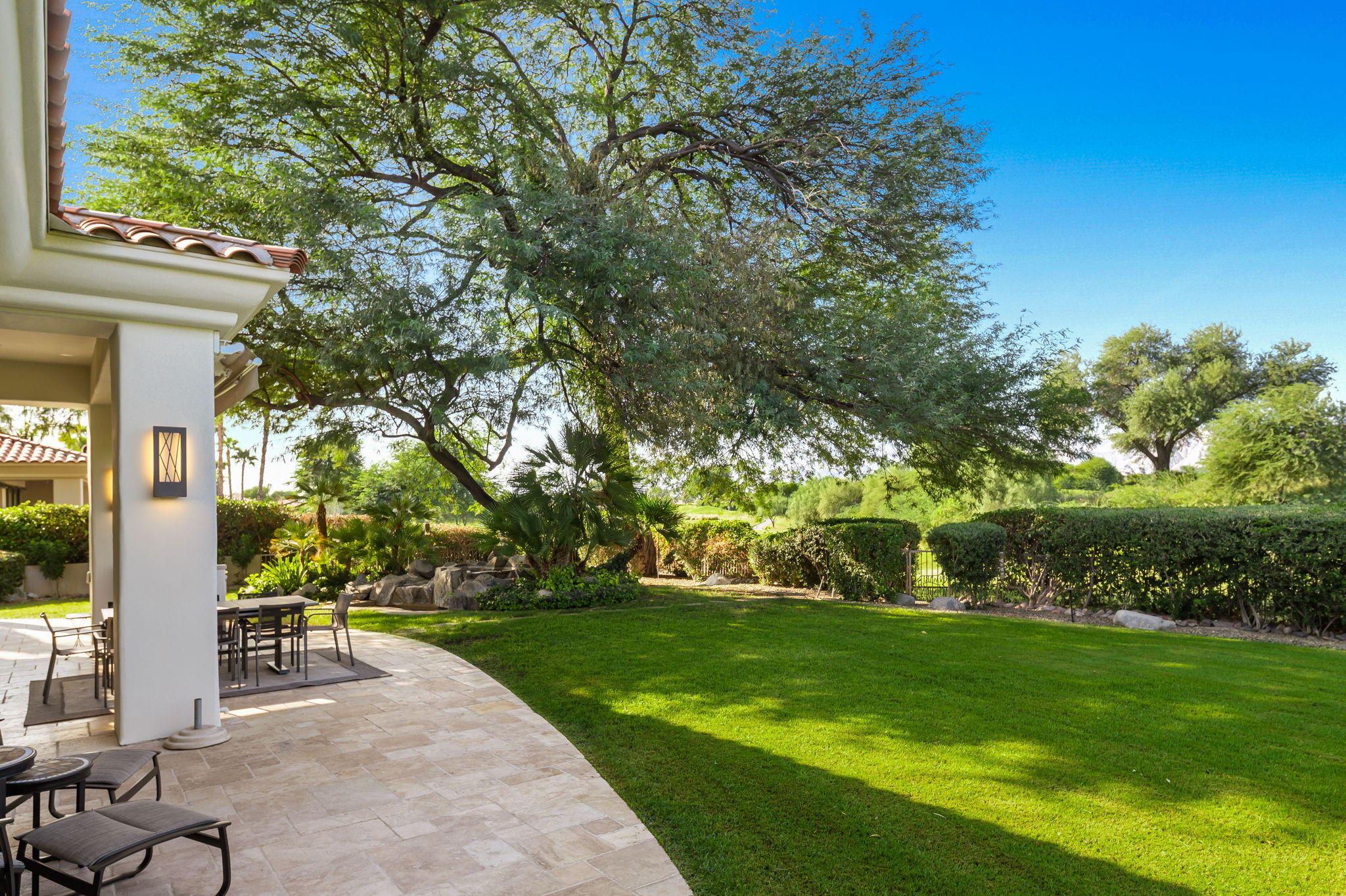 202 Loch Lomond Road Rancho Mirage, CA 92270 - Photo 40 of 47 a view of house with garden and a trees