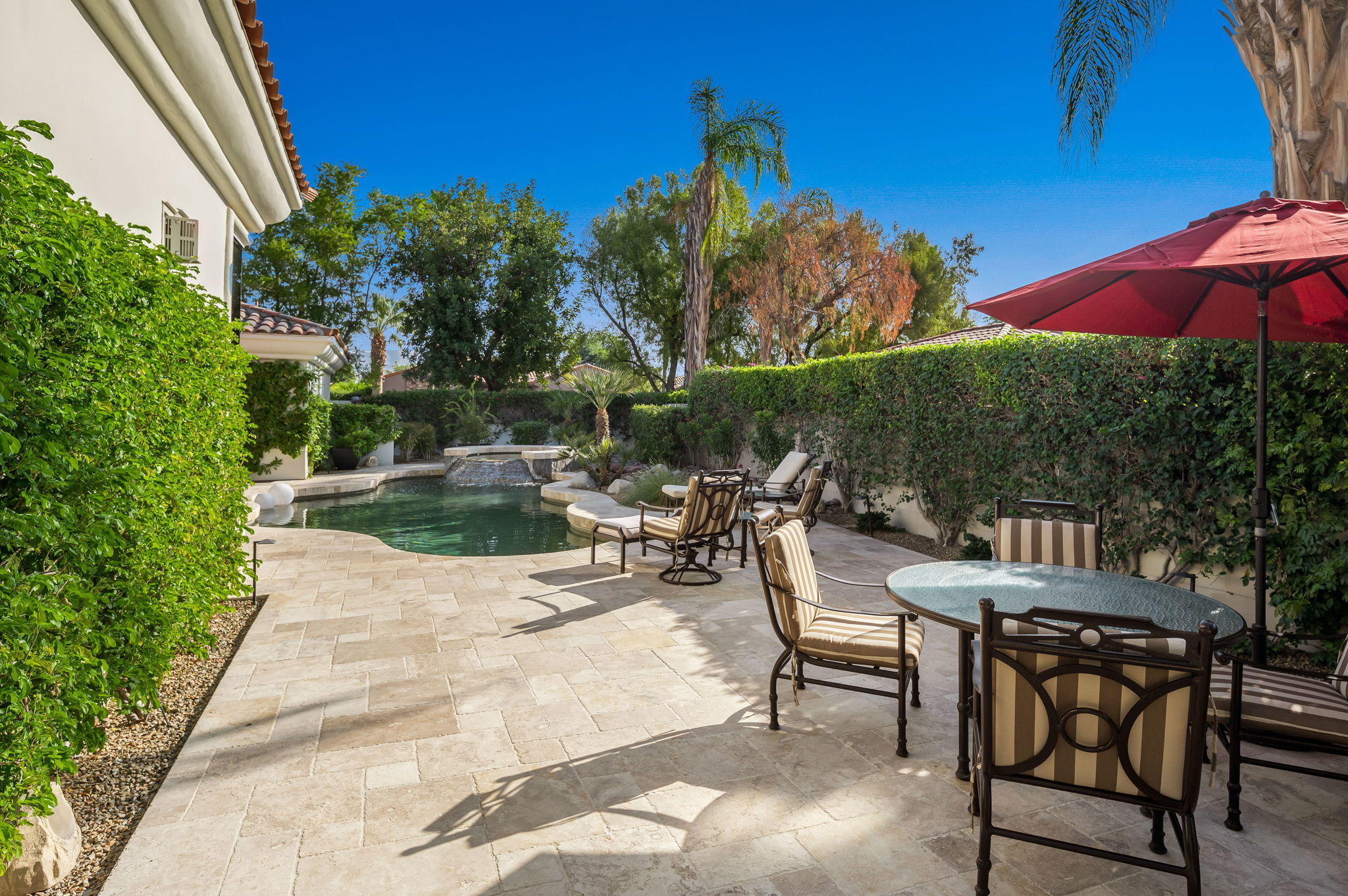 202 Loch Lomond Road Rancho Mirage, CA 92270 - Photo 41 of 47 a view of a backyard with sitting area